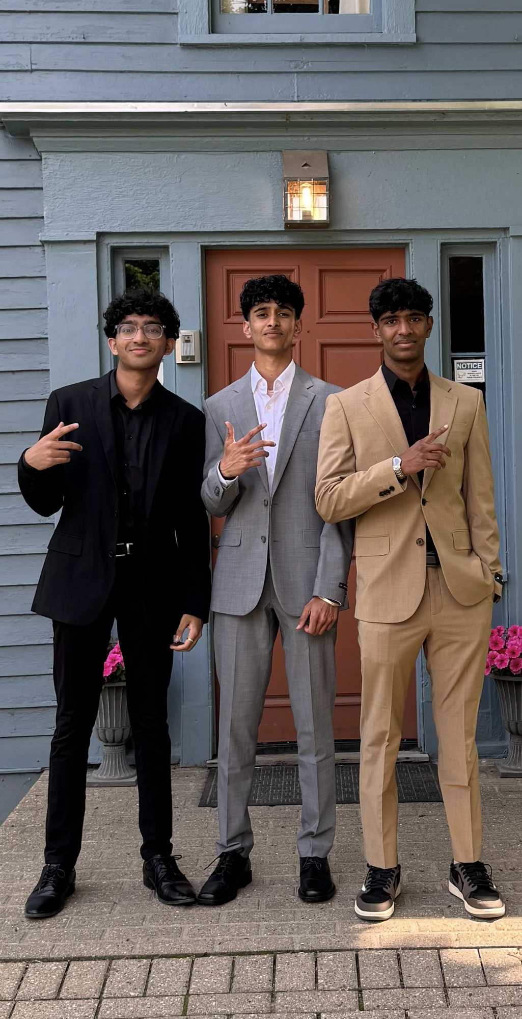 Dev and two friends in suits